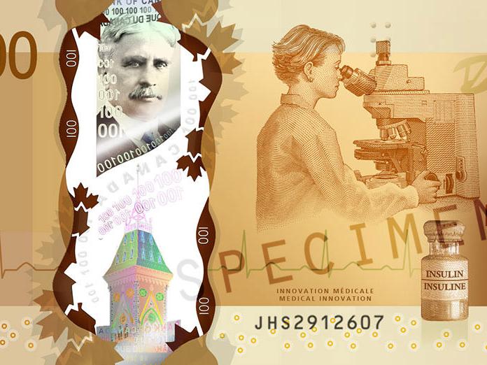 Vista de perto da nota de 100 dólares canadenses mostrando, entre outras coisas, um microscópio ZEISS.