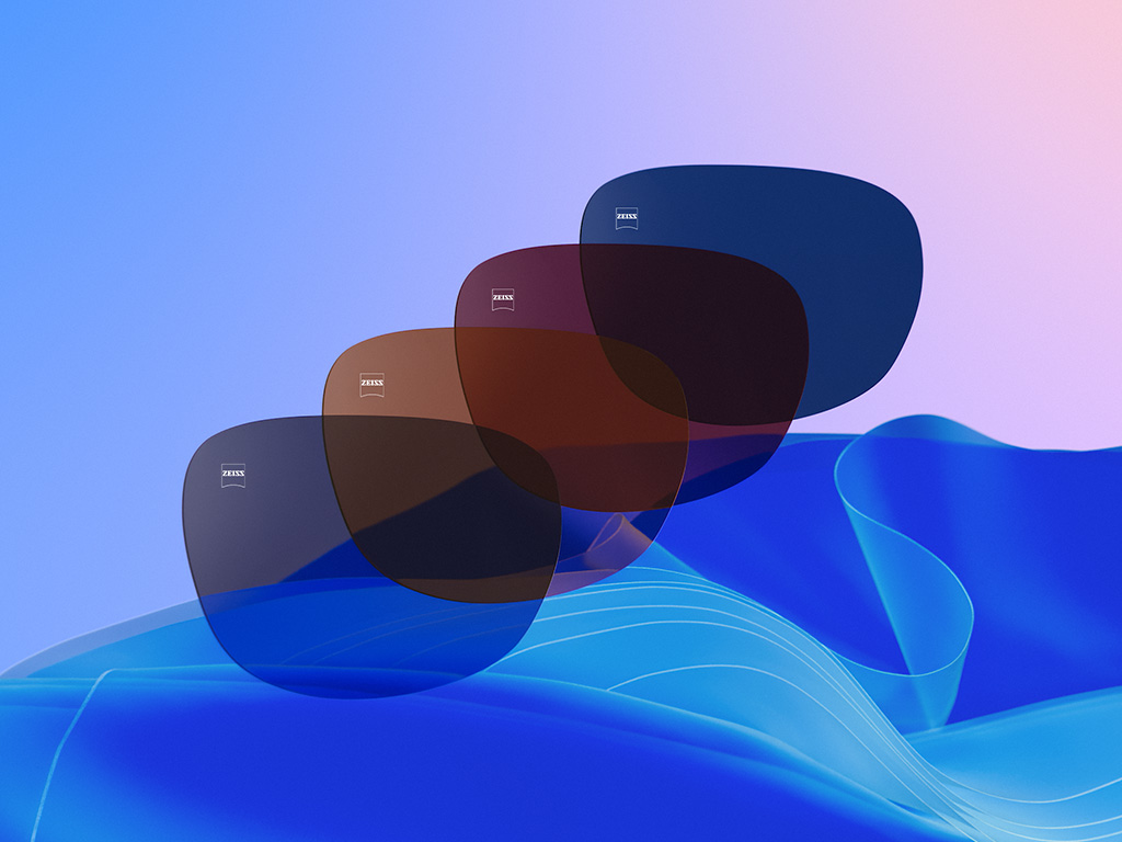 Ilustração 3D CGI de quatro lentes coloridas nas tonalidades Dusk Grey, Copper Brown, Burgundy e Midnight Blue.