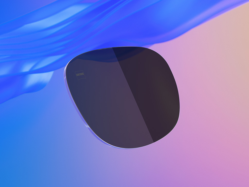 Ilutração 3D CGI de uma lente de óculos de sol colorida, com metade dela exibindo um nível de escurecimento mais intenso que a outra.