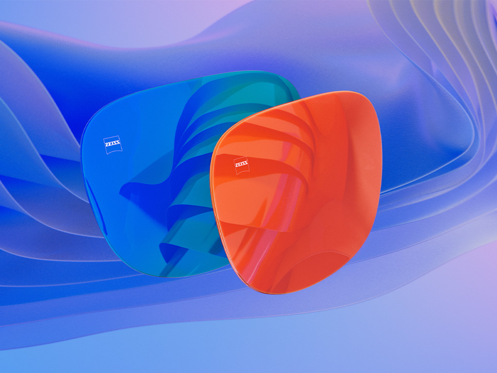 Ilustração 3D CGI de duas lentes para óculos de sol com tratamento espelhado azul e laranja.
