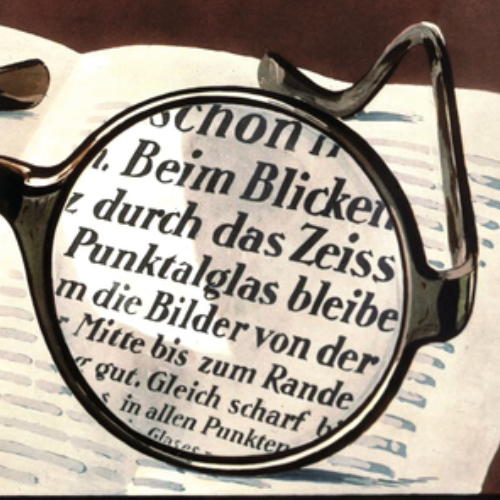 Imagem de um anúncio antigo das lentes ZEISS Punktal mostrando uma visão nítida em toda a superfície da lente. Isso era algo revolucionário em 1912. 