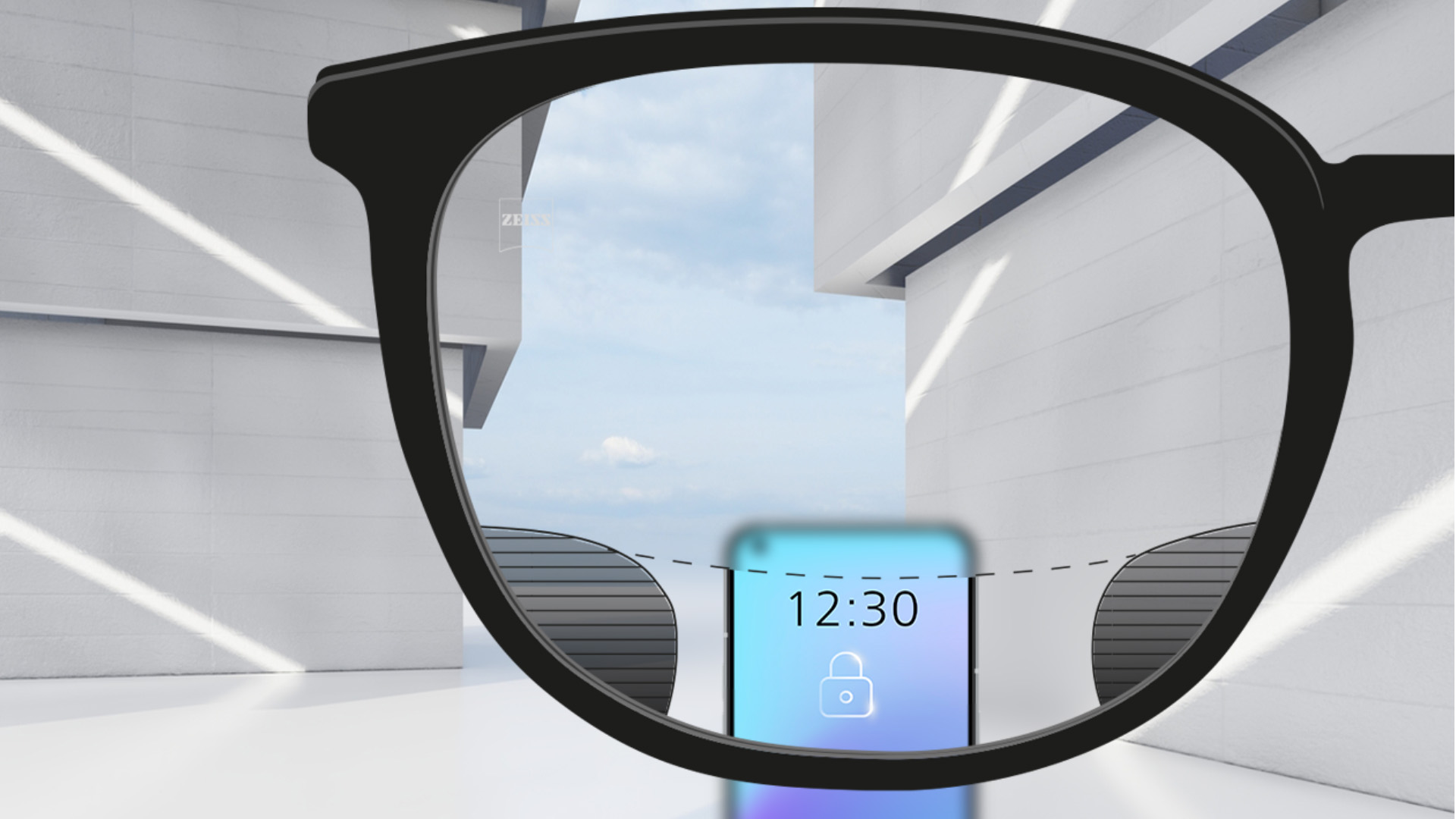 Imagem de ponto de vista das lentes ZEISS Digital SmartLife com um smartphone e nitidez total nas áreas superior e inferior da lente e pequenas linhas finas borradas à direita e à esquerda.