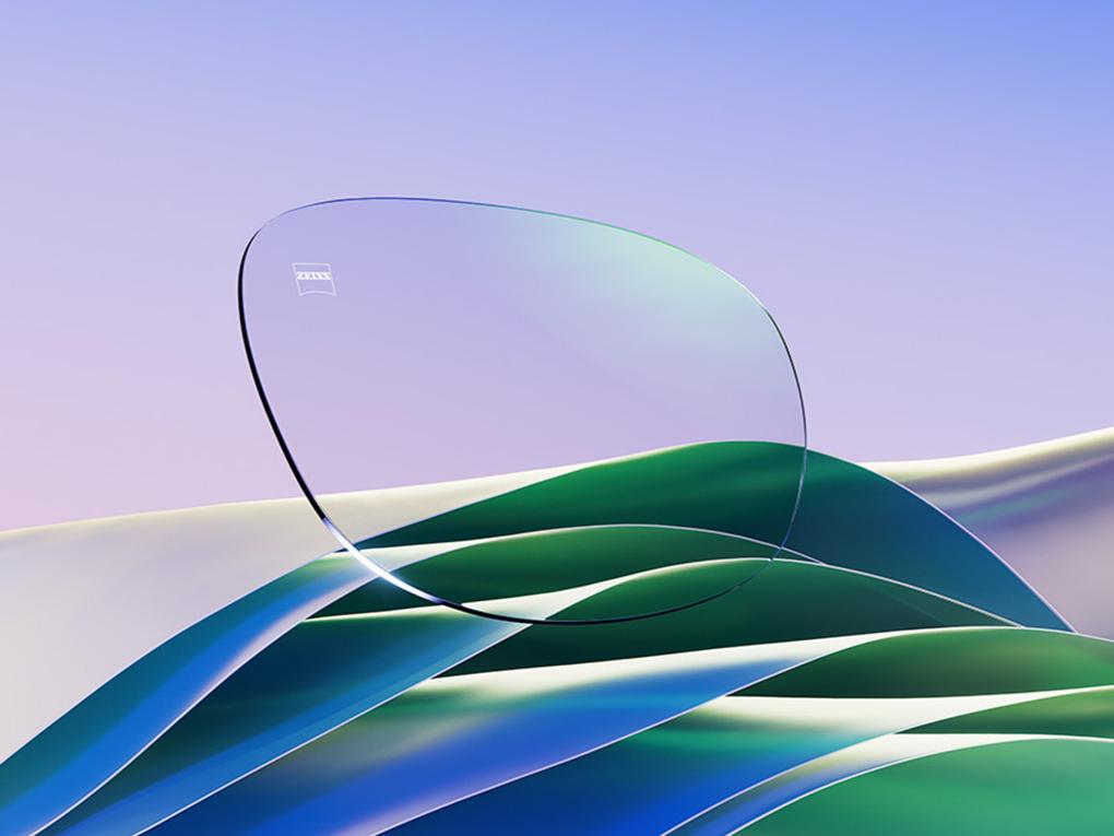 Representação CGI de uma lente de óculos incolor com um reflexo verde sutil.
