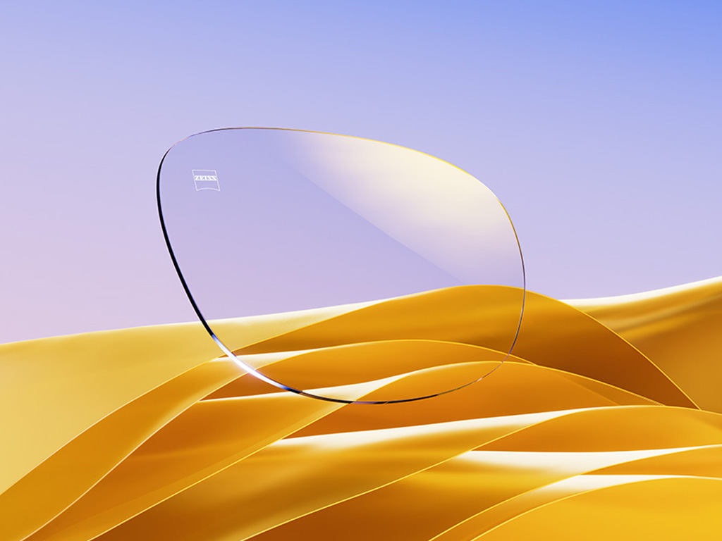 Representação CGI de uma lente de óculos incolor com um reflexo dourado sutil.