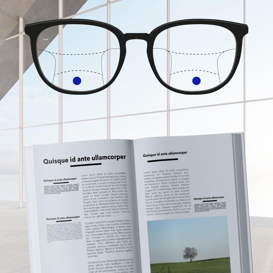 Armação com lentes progressivas e linhas esquematizadas indicando as diferentes zonas de visão. As diferentes partes da lente estão em destaque: perto - parte inferior dos óculos.