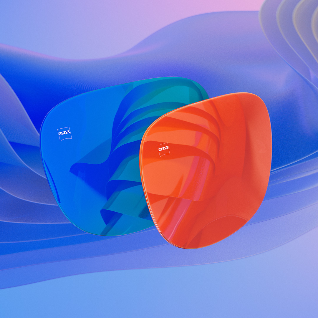 Uma representação em CGI de lentes para óculos de sol com acabamento espelhado colorido em azul e laranja.