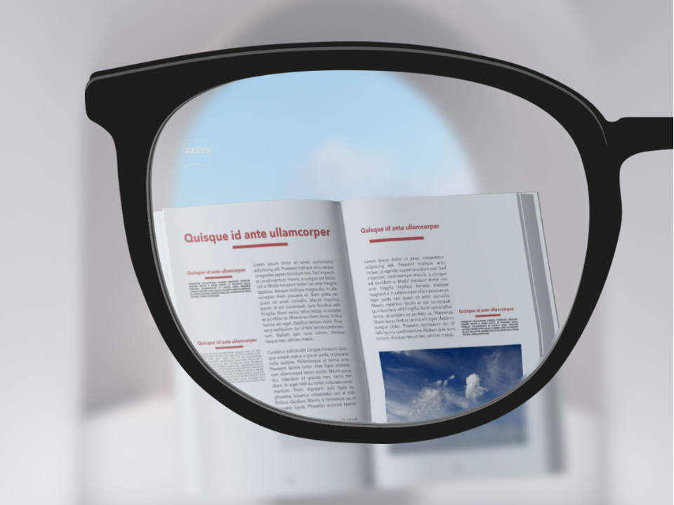  Imagem do ponto de vista das lentes ZEISS Single Vision ClearView com um livro e a lente totalmente nítida. 
